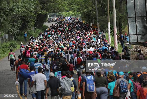 ESQUIPULAS, GUATEMALA - OCTOBER 16:  Some 1,500 Honduran immigrants walk north in a migrant caravan on October 16, 2018 near Esquipulas, Guatemala. The caravan, the second of its size in 2018, began last week in San Pedro Sula, Honduras with plans to march north through Guatemala and Mexico in route to the United States.  (Photo by John Moore/Getty Images)