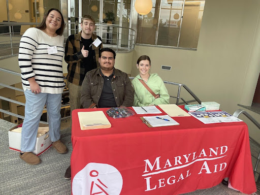 Student volunteers and people from Maryland Legal Aid greet the clients at the door.
