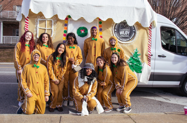 WLOY staff posing with the gingerbread van float