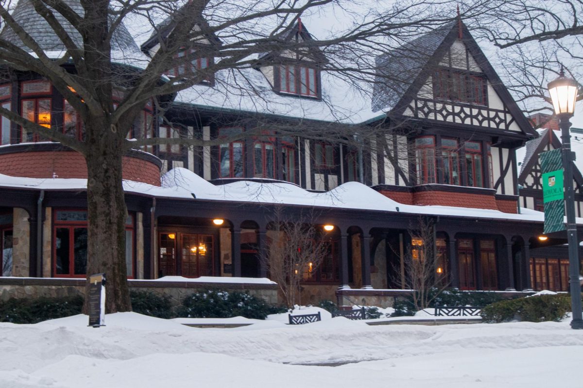 The Humanities building as snow accumulates 